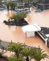 Holiday flights axed as floods sweep through sunshine isle Holiday flights axed as floods sweep through sunshine isle
