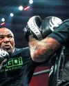 Tyson offers reminder of boxing's glory days before weary return