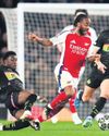 Driouech's deft chip earns PSV draw but Arsenal march on