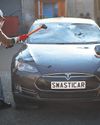 Car battery Musk critics smash Tesla in art project