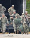 Trump calls for elected officials to be jailed as troops arrive in Chicago35