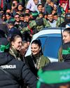 I just want to hug those girls' Bittersweet joy and relief as freed soldiers return home