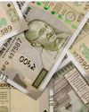 Rupee falls 12 paise to record low of 85.27 against US dollar