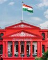 Karnataka High Court: In revision jurisdiction while considering discharge plea court has to only see if IO collected sufficient material or not