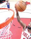 Bulls down 76ers, Pistons fall22