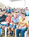 Political rivals unite to give ethnic Manobo children shoes