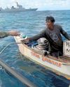 Chinese navy sailors aid Phl fisherman2