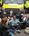 45 quizzed by police after migrant coach is blocked in London protest