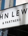 John Lewis cuts first-half losses after turnaround