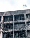 Silence, soot-covered buildings stand as grim reminders37