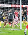 Carrick stuns Gunners to blow title race open21