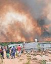 Families flee their homes and roads closed due to raging fires17