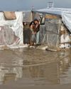 Displaced Gaza newborn freezes to death and twin fights for his life as rain floods tents