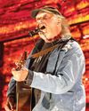 Neil Young says he will play Glastonbury after all