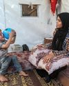 2 years after viral photo with dead niece, Gaza woman holds on to nephew 2 years after viral photo with dead niece, Gaza woman holds on to nephew24