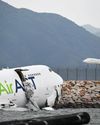 Cargo plane skids off HK runway, killing two on ground26