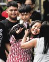 Filipina nearly executed in Indonesia arrives home after 14 years