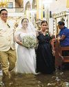 Wading down the aisle: Filipino couple tie the knot in flooded church13