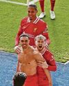 TAA may be Madrid bound, but bares his love for Reds after late winner sets up Anfield title party TAA may be Madrid bound, but bares his love for Reds after late winner sets up Anfield title party