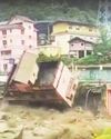 Hotel topples into river22