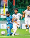 Rain fails to dampen football spirit as synthetic turf keeps game on51