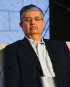 Uday Kotak urges Indian firms to step up as rupee crosses 909