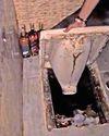 Cops find Rs 2.76L liquor under toilet Cops find Rs 2.76L liquor under toilet0