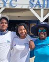 Black youth display boating sailing skills at Antigua Sailing Week