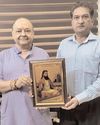 Balbir presents portrait of Guru Ravidass to prominent social activist Prem Gupta18