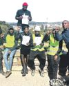 2 young men walk to Union Buildings for a cause7
