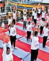 NTR district sets record with floating yoga on Krishna NTR district sets record with floating yoga on Krishna