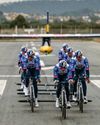 Nine Red Bull-Bora-hansgrohe riders tow a glider to take-off Nine Red Bull-Bora-hansgrohe riders tow a glider to take-off5